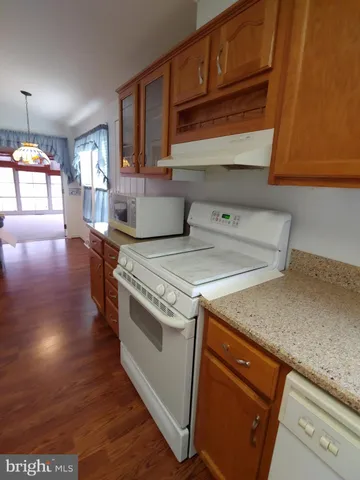 a kitchen with a stove and a sink