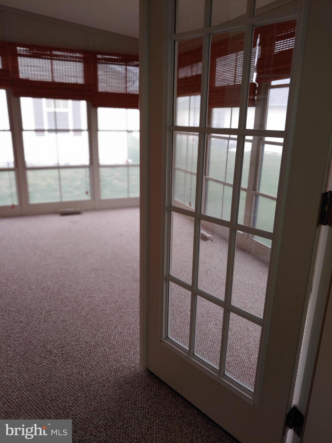 408 Moore Place, Unit 408 Dover, DE 19901 - Photo 16 of 34 French Doors to Porch