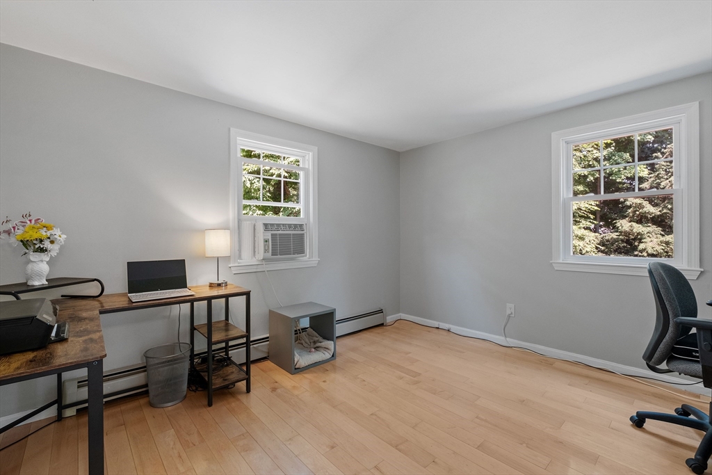 54 Alpine Street Milford, NH 03055 - Photo 12 of 33 a view of a workspace with furniture and a window