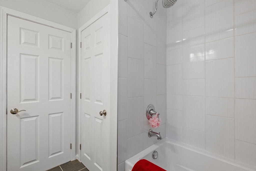 54 Alpine Street Milford, NH 03055 - Photo 15 of 33 a bathroom with a bathtub
