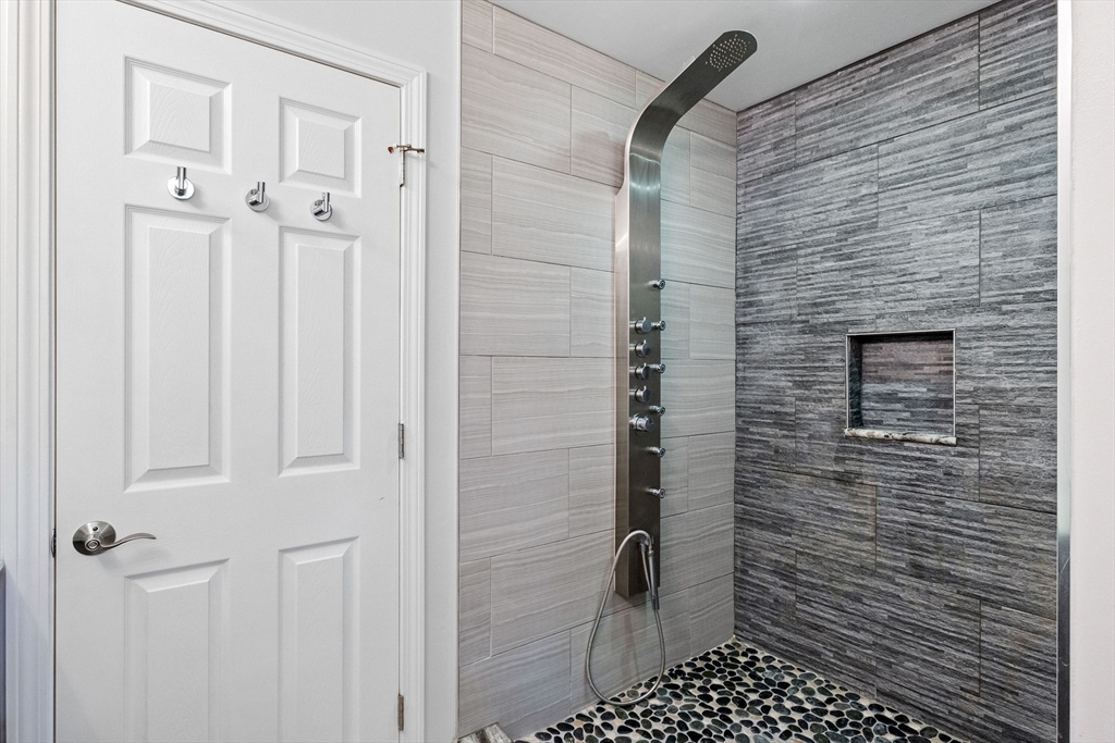 54 Alpine Street Milford, NH 03055 - Photo 19 of 33 a bathroom with a shower