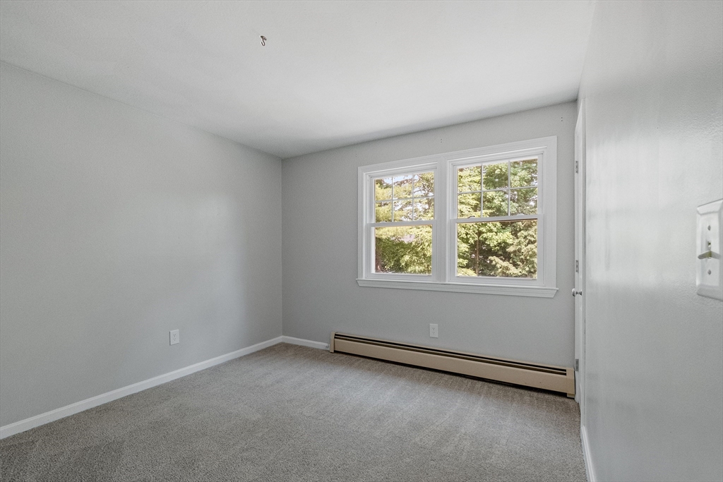 54 Alpine Street Milford, NH 03055 - Photo 22 of 33 an empty room with a window