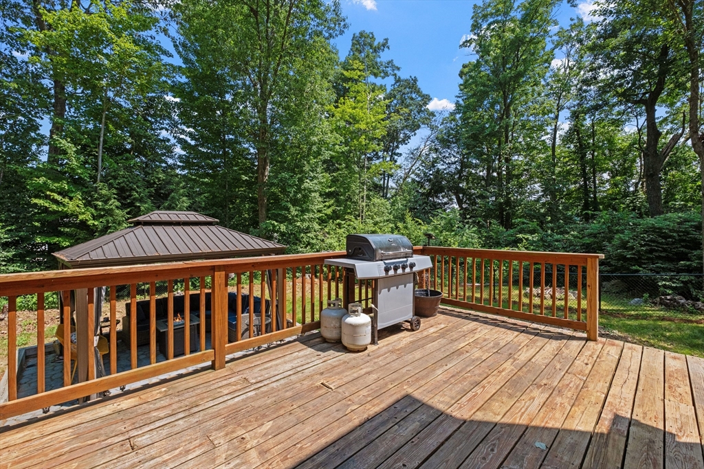 54 Alpine Street Milford, NH 03055 - Photo 23 of 33 a view of wooden deck and a patio