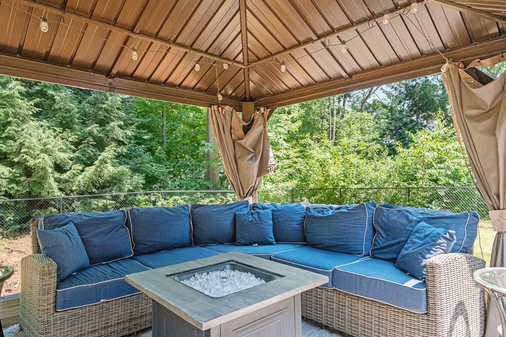 54 Alpine Street Milford, NH 03055 - Photo 26 of 33 a outdoor living space with furniture and garden view