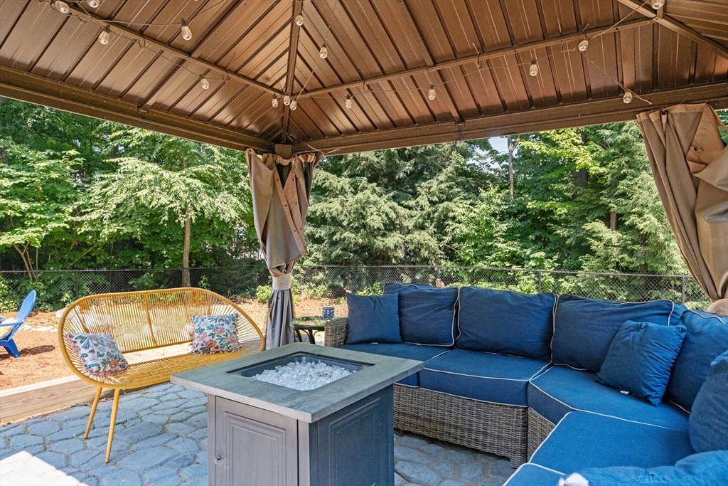 54 Alpine Street Milford, NH 03055 - Photo 27 of 33 a outdoor living space with furniture and garden view