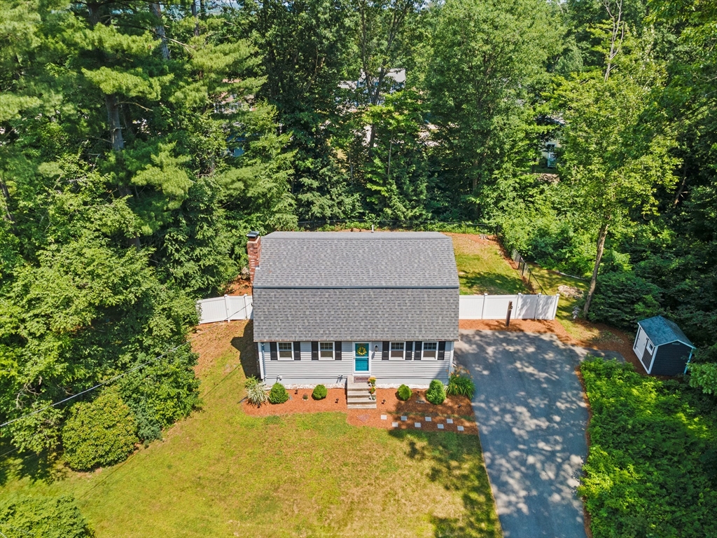 54 Alpine Street Milford, NH 03055 - Photo 32 of 33 an aerial view of a house with swimming pool and large trees