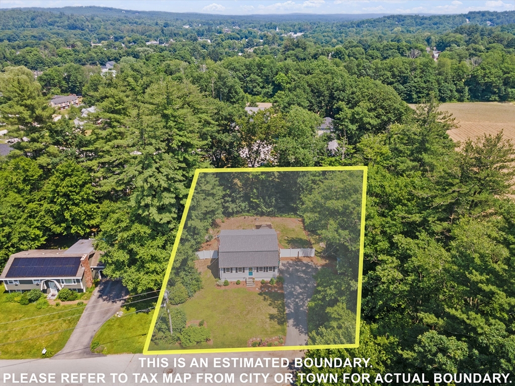 54 Alpine Street Milford, NH 03055 - Photo 33 of 33 an aerial view of a house with a yard