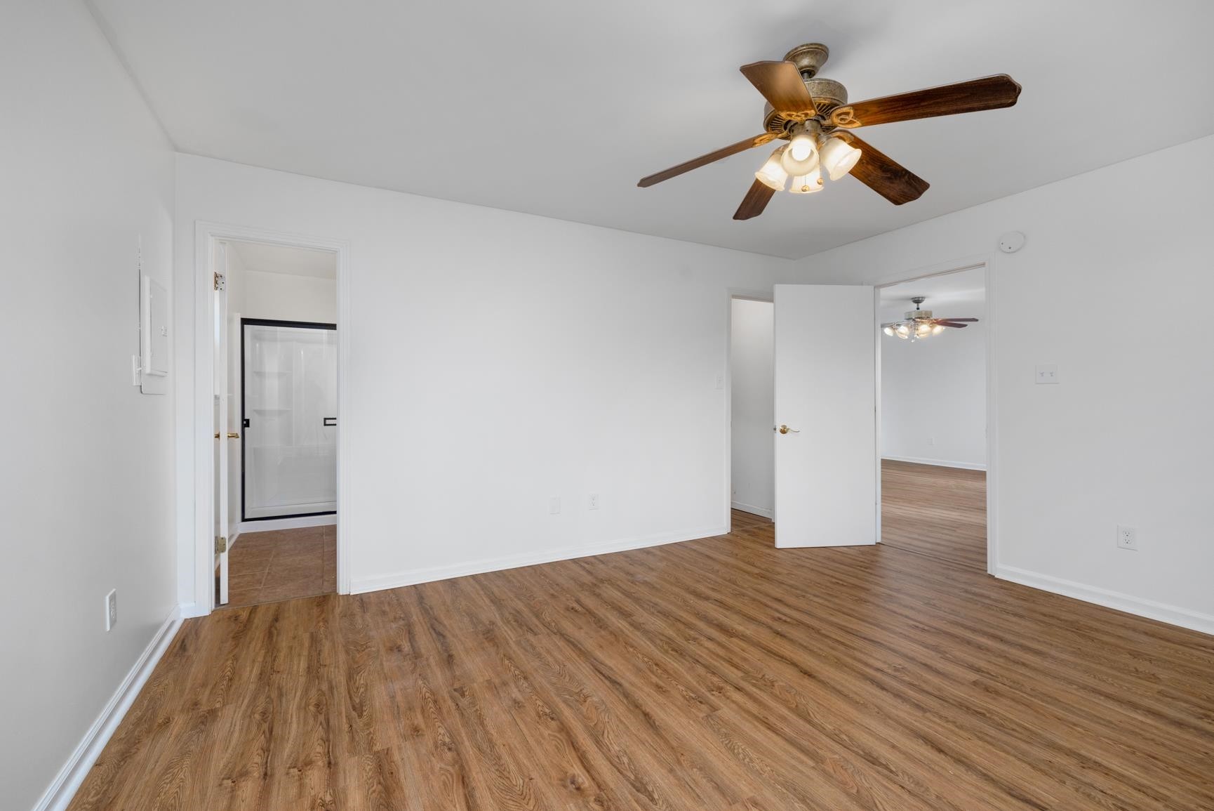 1388 Double Bridges Road Munford, TN 38058 - Photo 14 of 31 wooden floor in an empty room with a window