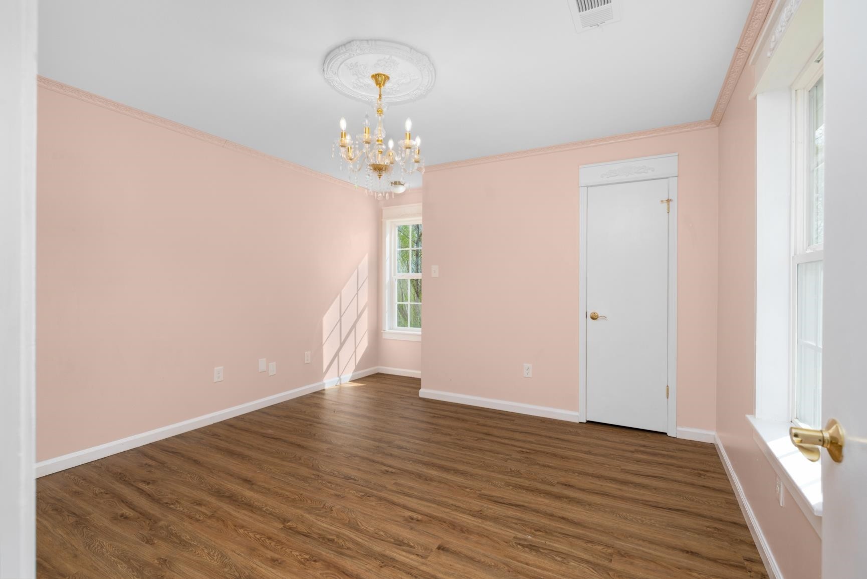 1388 Double Bridges Road Munford, TN 38058 - Photo 16 of 31 a view of an empty room with wooden floor