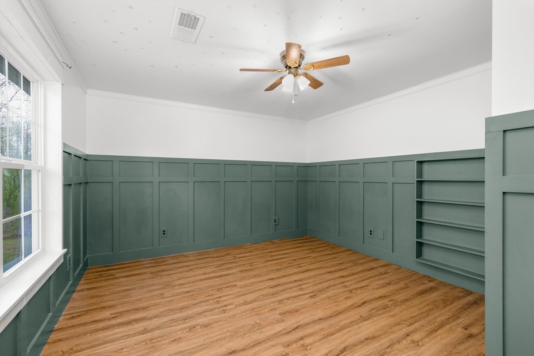 1388 Double Bridges Road Munford, TN 38058 - Photo 20 of 31 a bedroom with a bed and a chandelier
