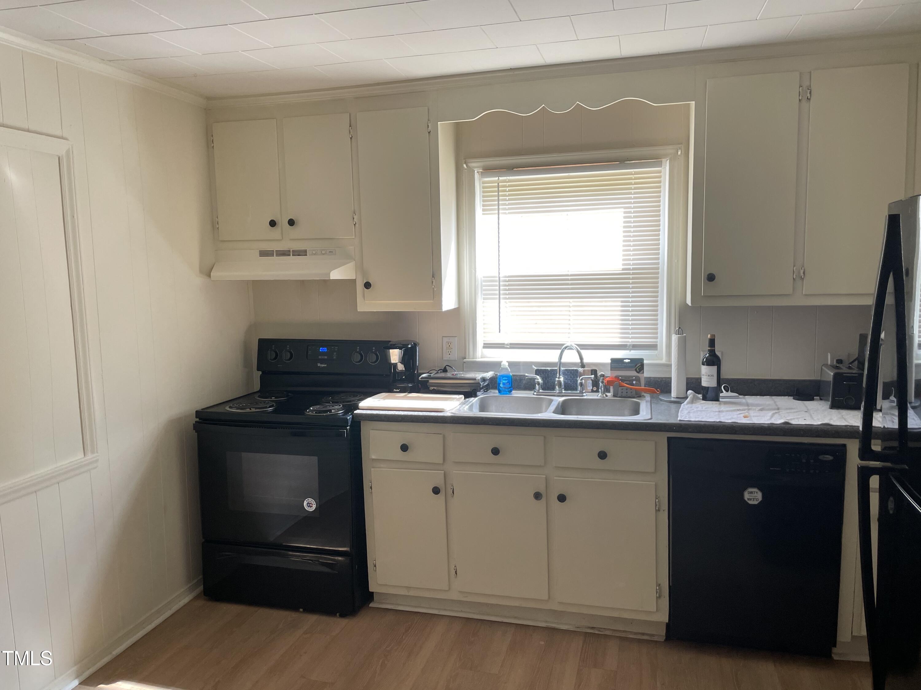 104 Summers Drive Elon, NC 27244 - Photo 5 of 11 a kitchen with granite countertop white cabinets and a sink