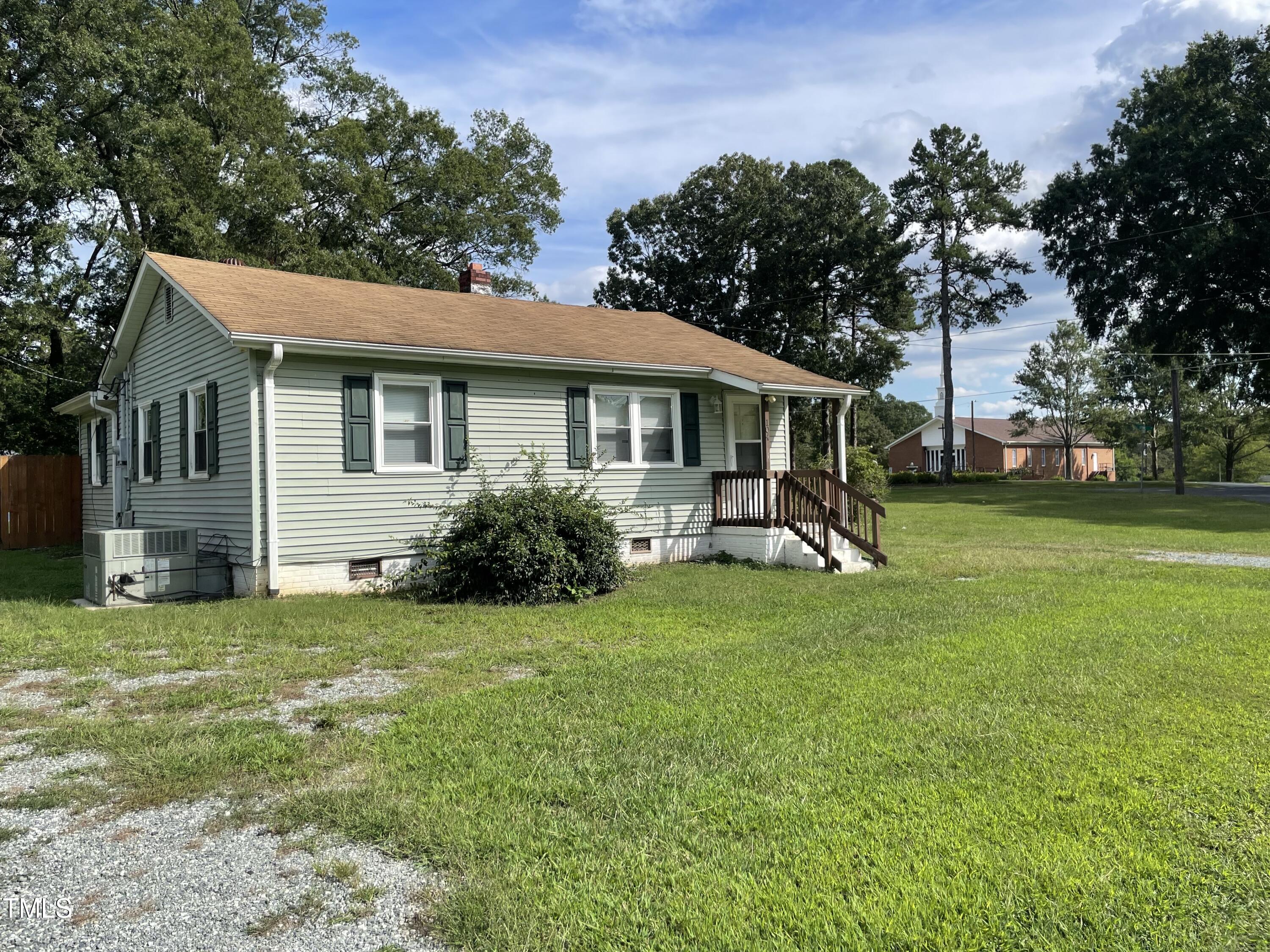 104 Summers Drive Elon, NC 27244 - Photo 8 of 11 a view of a house with a yard