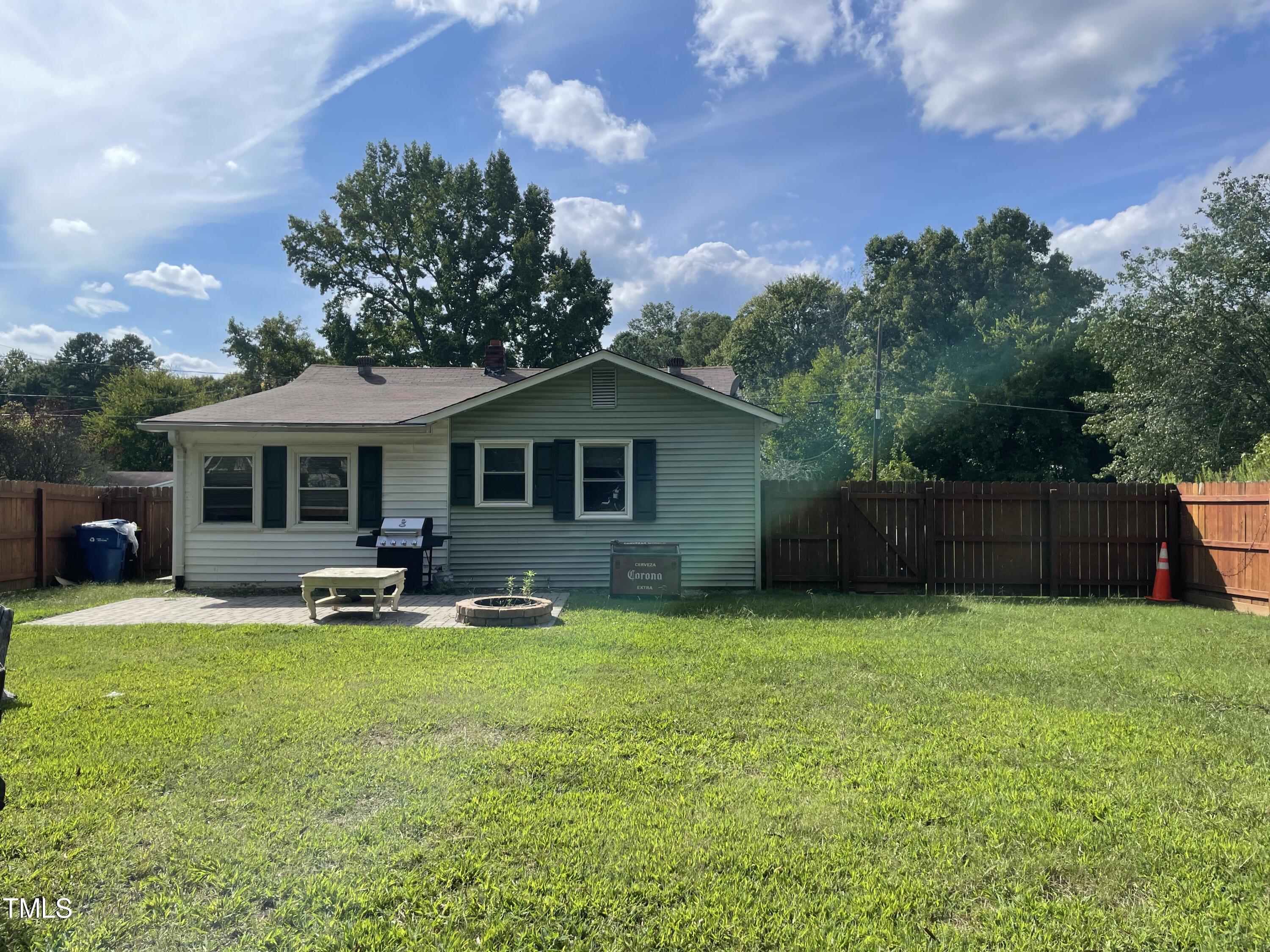 104 Summers Drive Elon, NC 27244 - Photo 9 of 11 a backyard of a house with table and chairs