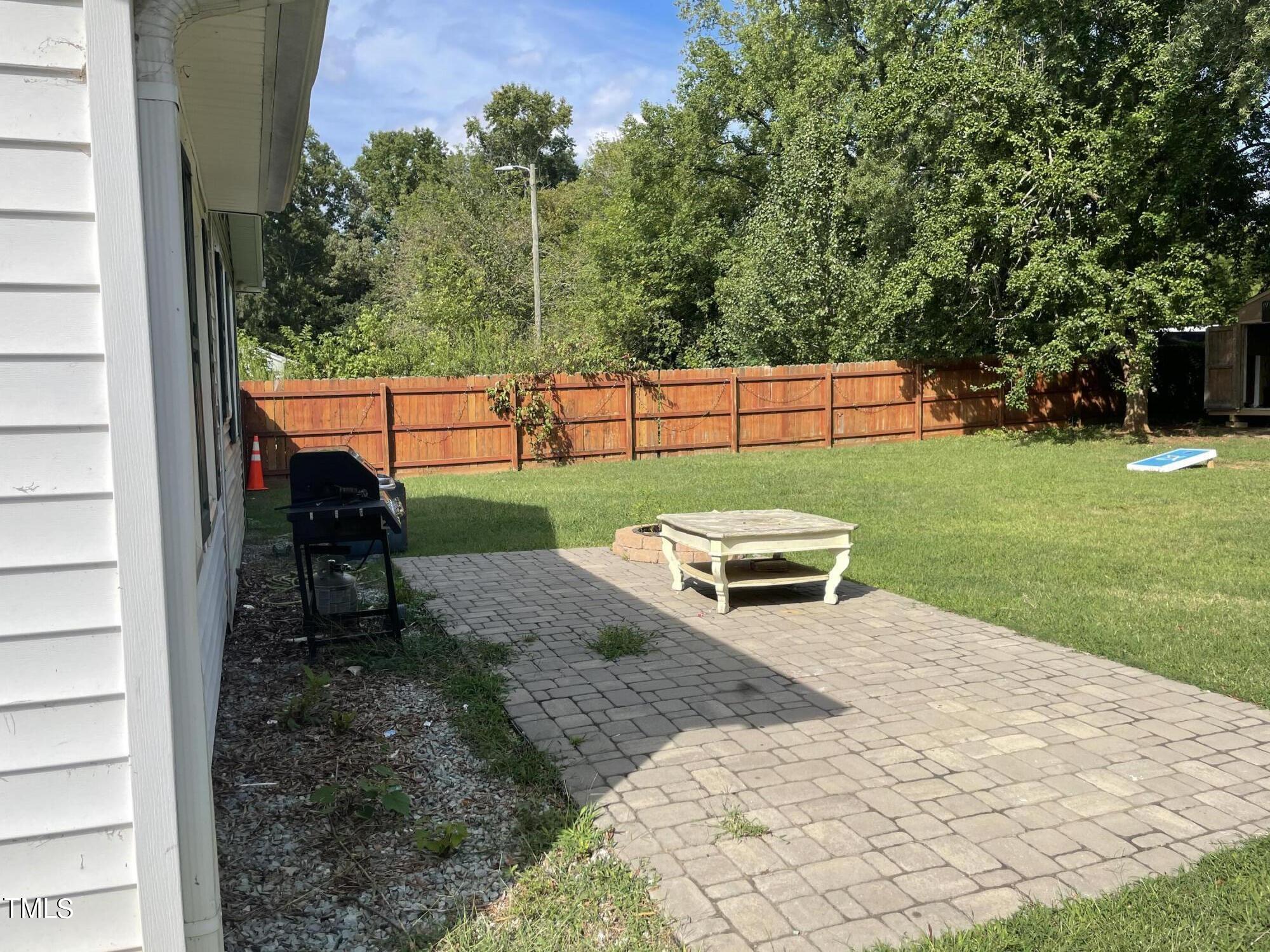 104 Summers Drive Elon, NC 27244 - Photo 10 of 11 a garden view with a sitting space