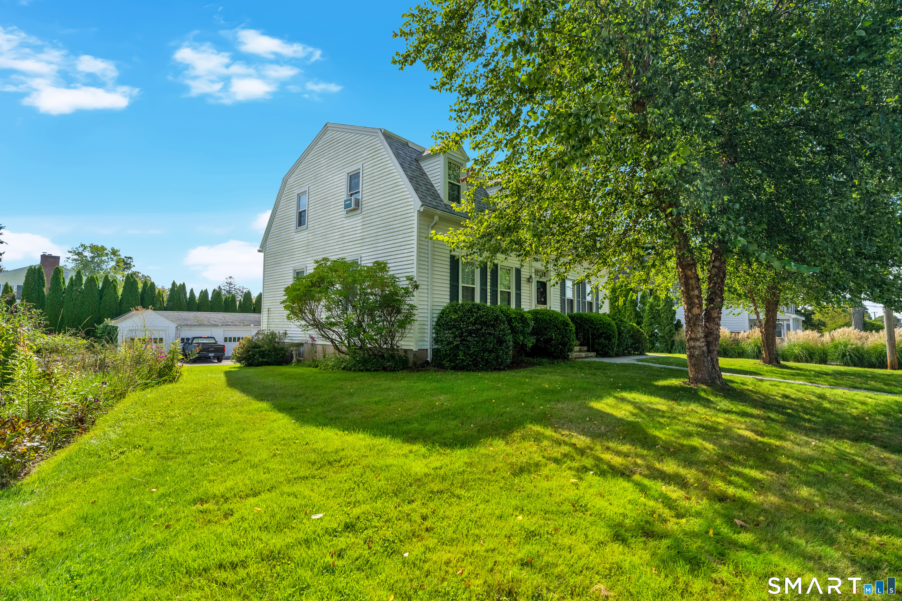 59 Spring Rock Road Branford, CT 06405 - Photo 36 of 38 Side view with yard, garages.