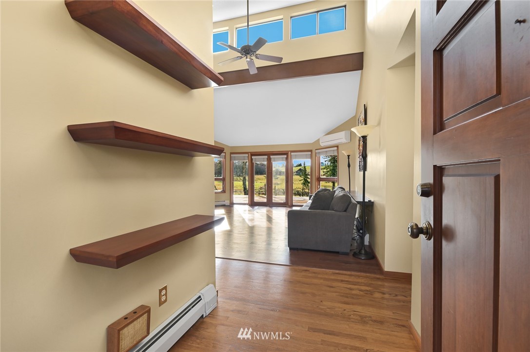 7110 Valley View Road Ferndale, WA 98248 - Photo 5 of 39 a hallway with furniture and wooden floor