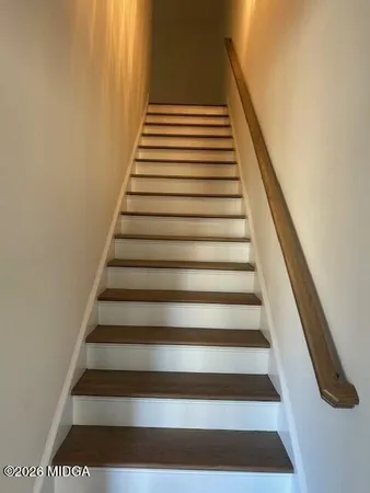 a bathroom with a toilet a sink and a mirror