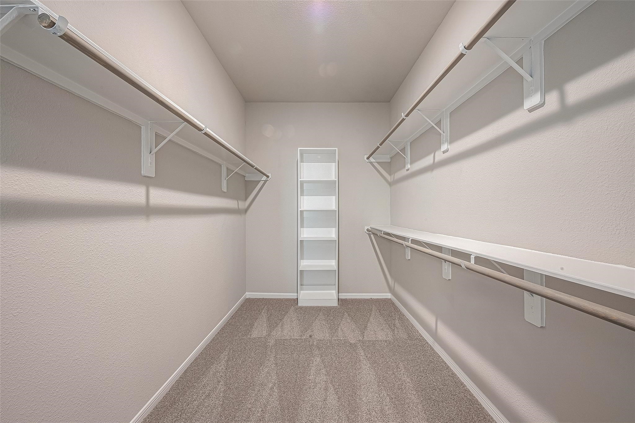 13306 Prado Rdg Lane Iowa Colony, TX 77583 - Photo 33 of 38 a view of a room with racks on the wall