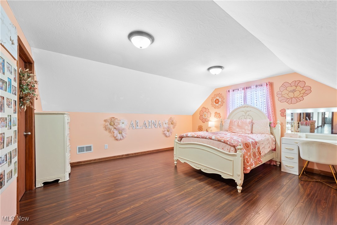 399 Wilder Road Vinton, OH 45686 - Photo 22 of 36 Bedroom with dark wood-type flooring and a textured ceiling