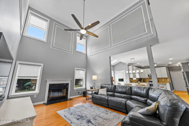 a living room with furniture and a fireplace