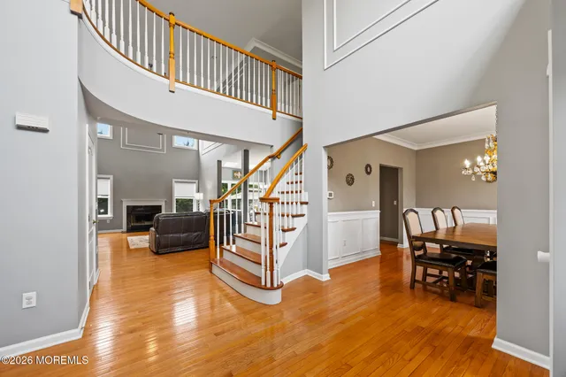 a spacious bathroom with a double vanity sink mirror and bathtub
