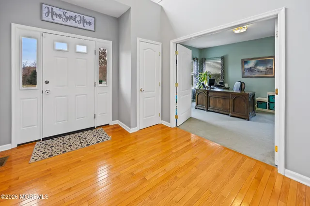 a living room with furniture rug and a fireplace