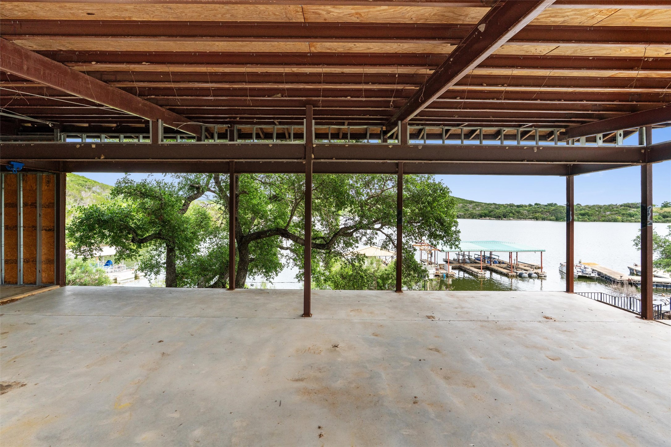 325 Eagle Rest Burnet, TX 78611 - Photo 35 of 40 Lakefront views unfold from this expansive, unfinished open-air space, perfect for custom living.