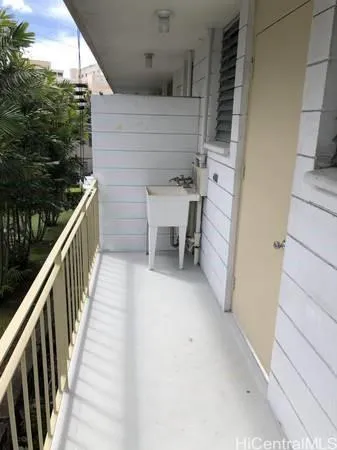 a view of a balcony with chairs