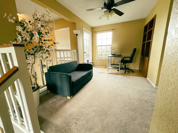 a living room with furniture and a window