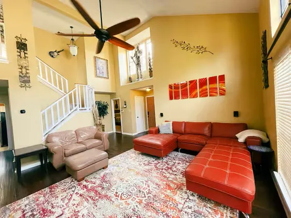 a living room with furniture and a rug
