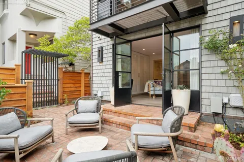 a outdoor living space with furniture and a potted plant
