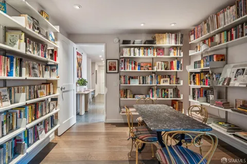 a view of a workspace with bookshelf