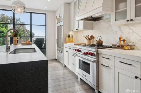 a kitchen with a stove and a sink