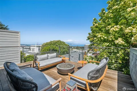 a view of a patio with couches and potted plants