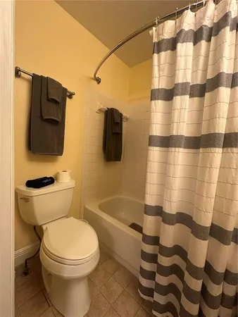 a bedroom with a bed and chair