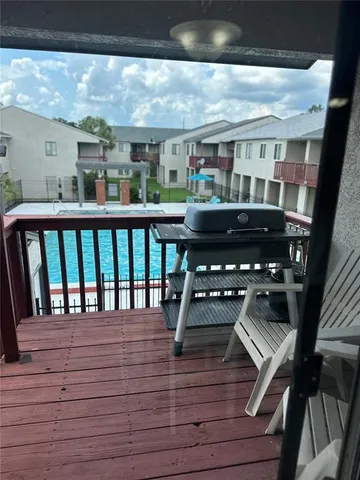a view of a backyard with a large tree