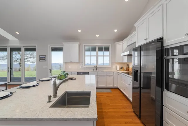 a bathroom with a sink toilet and mirror