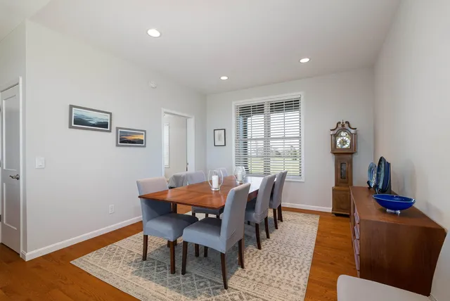 a bathroom with a double vanity sink and mirror with window