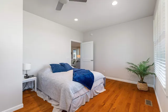 a front view of a house with a yard covered in snow