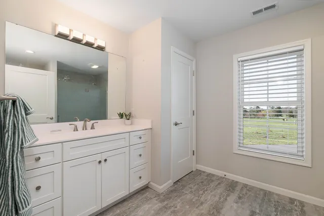 a front view of a house with a swimming pool