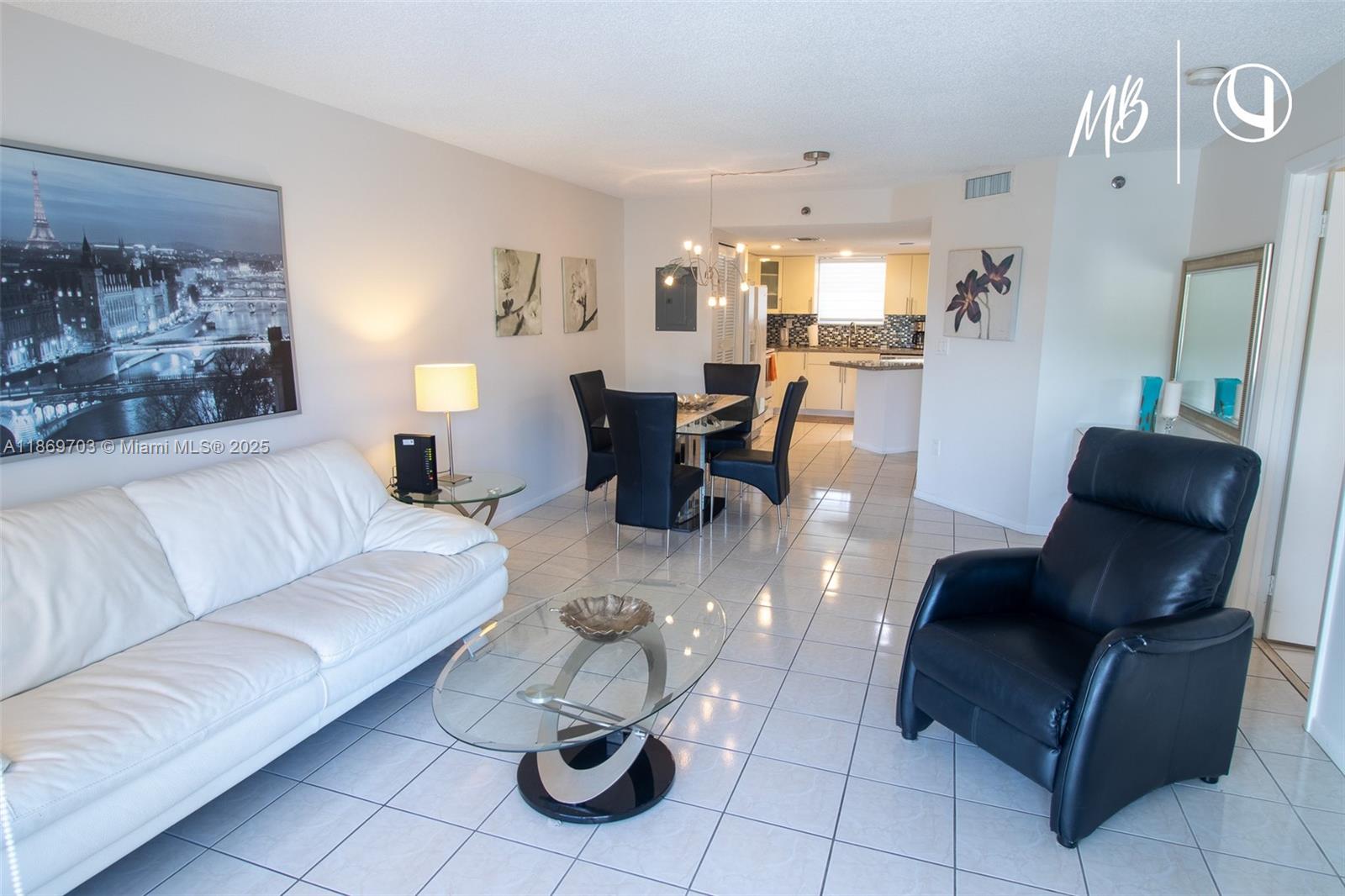 17801 North Bay Road, Unit 410 Sunny Isles Beach, FL 33160 - Photo 11 of 24 a living room with furniture and wooden floor