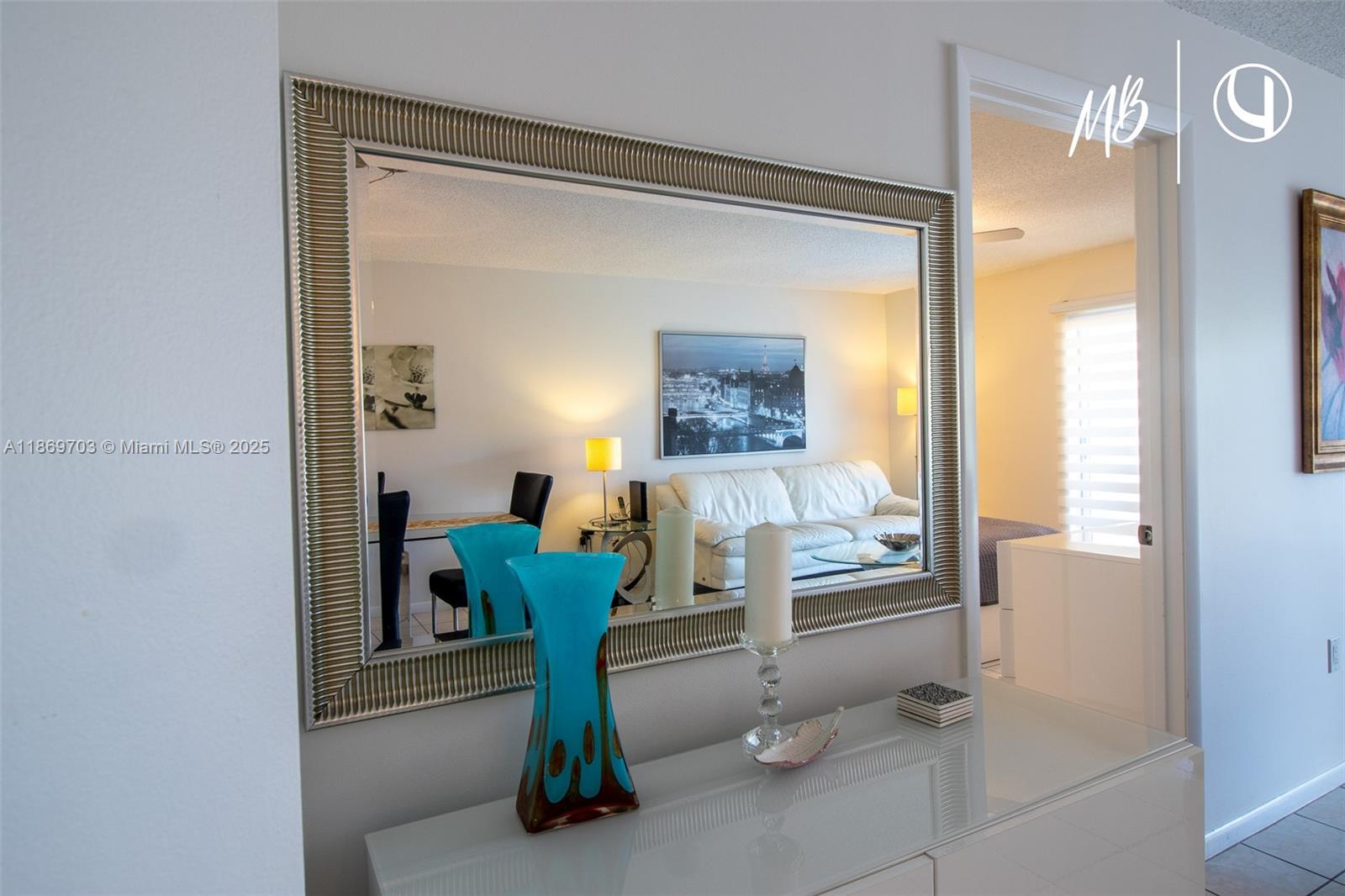 17801 North Bay Road, Unit 410 Sunny Isles Beach, FL 33160 - Photo 12 of 24 a room with furniture and a potted plant