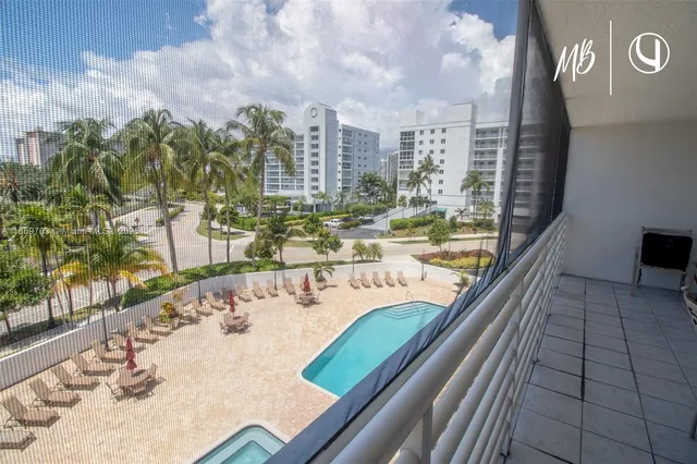 a view of swimming pool from a balcony