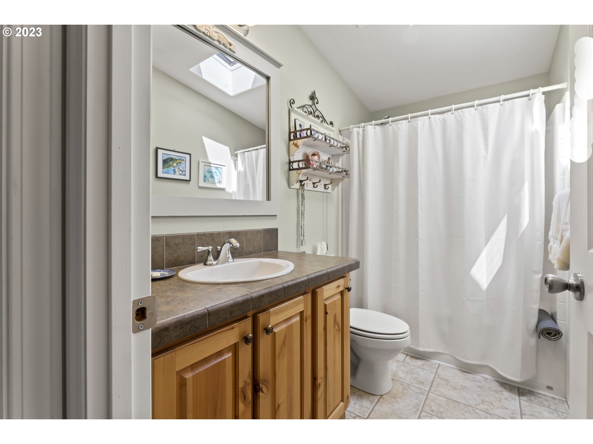 175 Florentine Avenue Florence, OR 97439 - Photo 21 of 27 a bathroom with a granite countertop sink toilet and a mirror