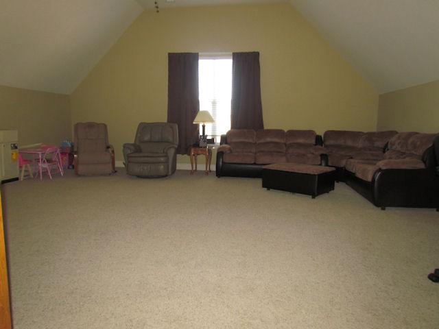 3676 Big Springs Road Lebanon, TN 37090 - Photo 11 of 20 The large upstairs bonus room has carpet and a ceiling fan.