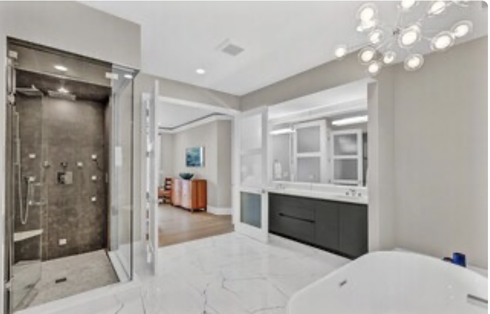 1157 West Erie Street, Unit 5W Chicago, IL 60642 - Photo 23 of 30 a bathroom with a tub shower and sink