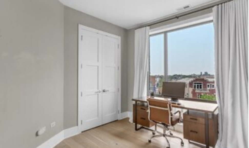 1157 West Erie Street, Unit 5W Chicago, IL 60642 - Photo 26 of 30 a view of a workspace with furniture and a window