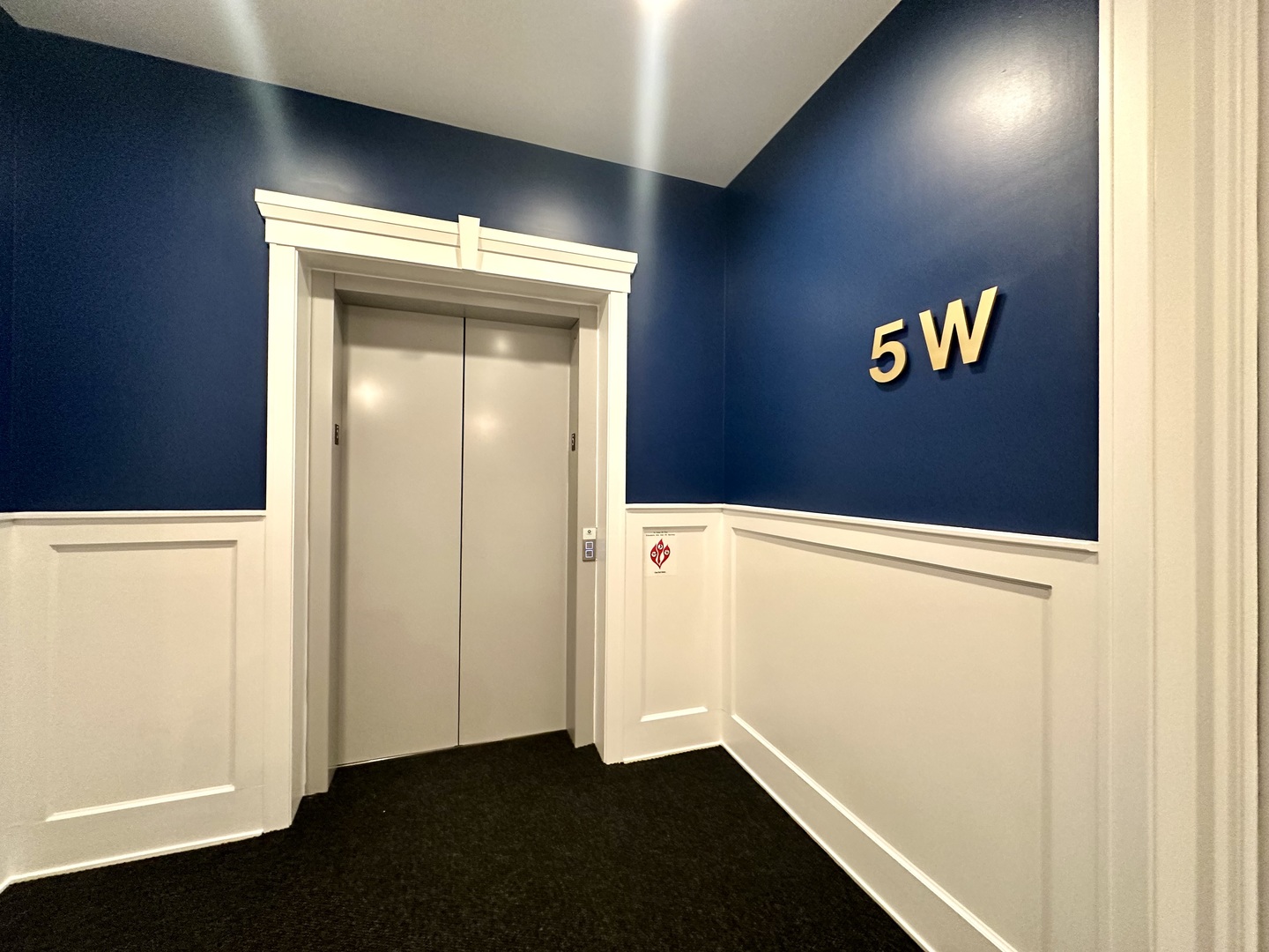 1157 West Erie Street, Unit 5W Chicago, IL 60642 - Photo 5 of 30 a view of an entryway with wooden floor
