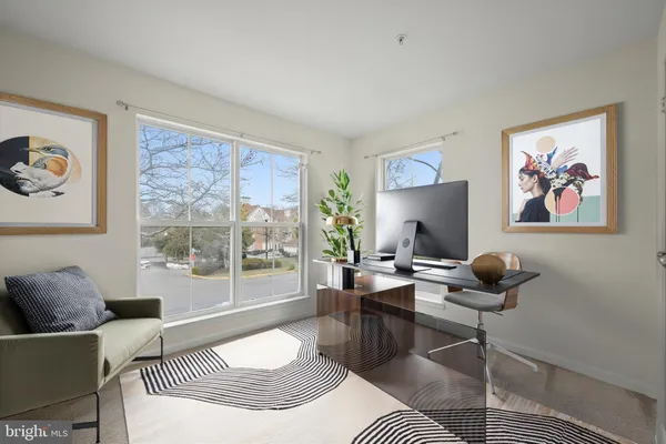 a spacious bedroom with a bed and a couch
