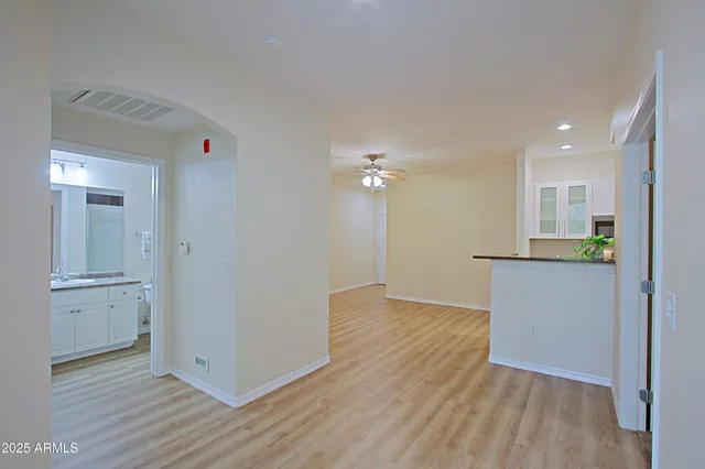 a kitchen with stainless steel appliances a refrigerator sink and stove